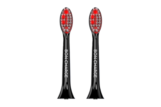 Black electric toothbrush head with red bristles